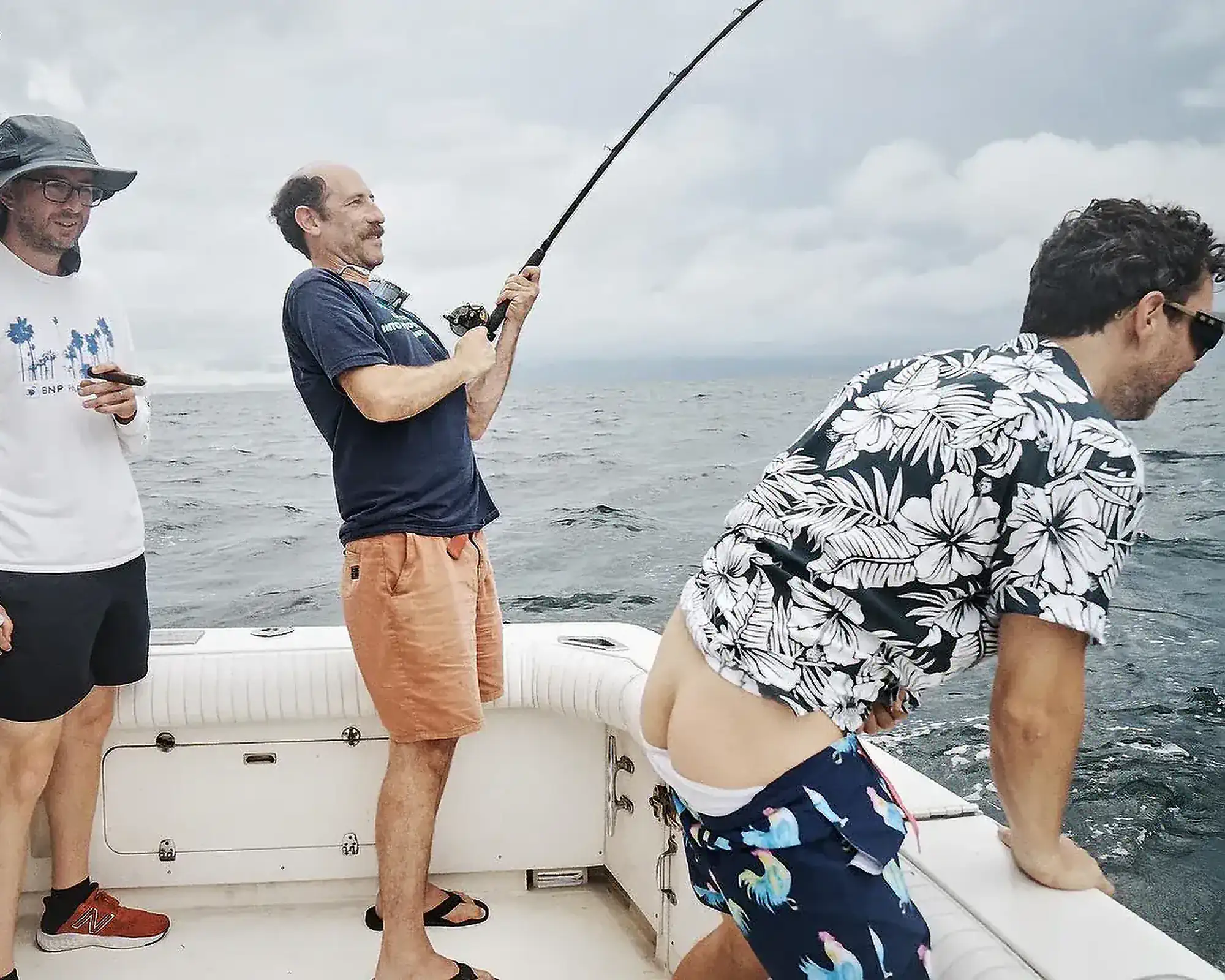 Ari Shaffir and Joe Fishing on a Boat with Mark Showing his Butt | Mark Normand and Joe List | Tuesdays with Stories Comedian Ari Shaffir fishing on a fishing boat with comedians Mark Normand and Joe List of Tuesdays with Stories, with Mark showing his butt crack. Find more Tuesdays with Stories photos at www.tuesdayspod.com/photos