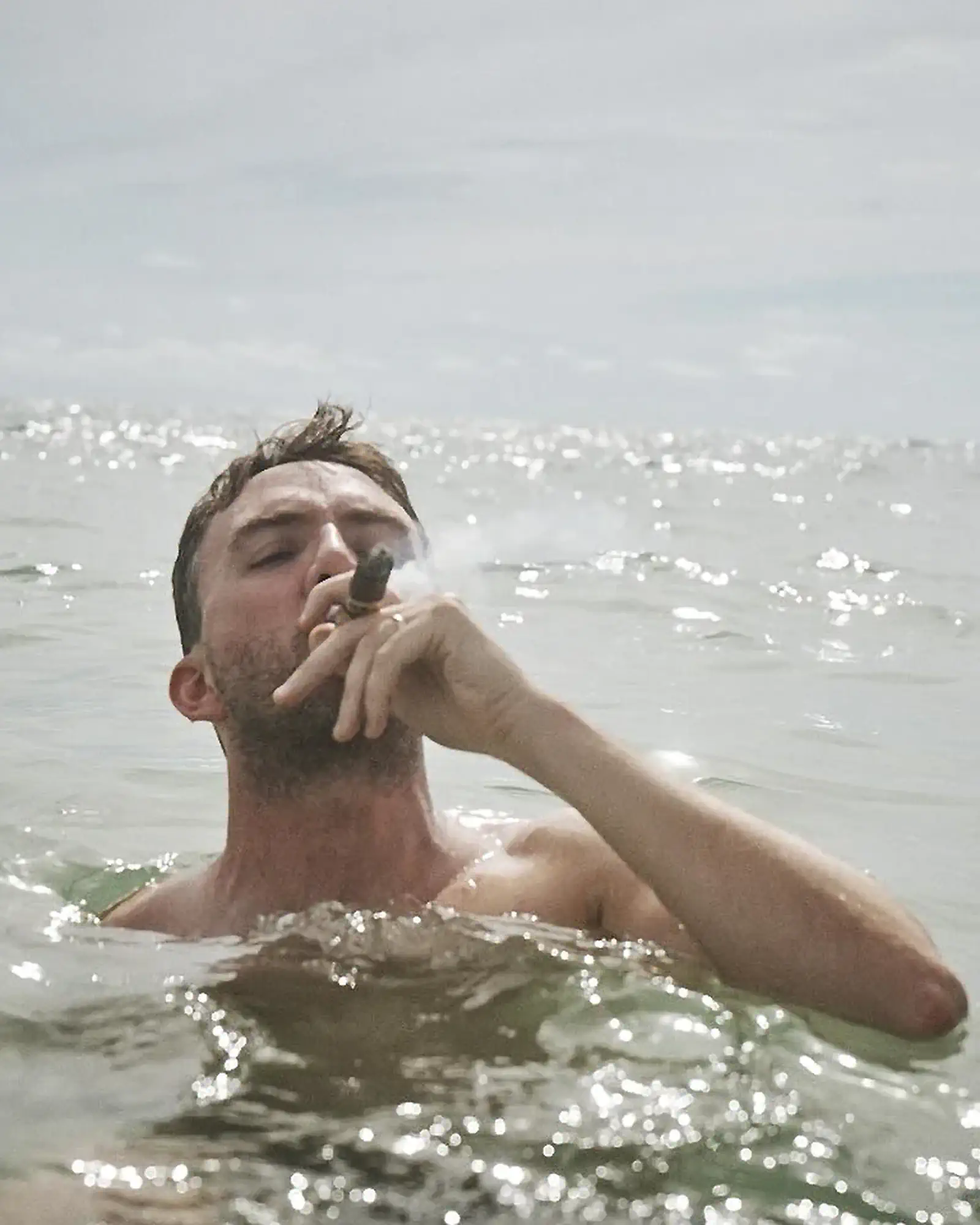 Joe Smoking a Cigar in the Ocean | Joe List | Tuesdays with Stories Comedian Joe List of Tuesdays with Stories smoking a cigar in the ocean. Find more about Joe at www.tuesdayspod.com/joe-list