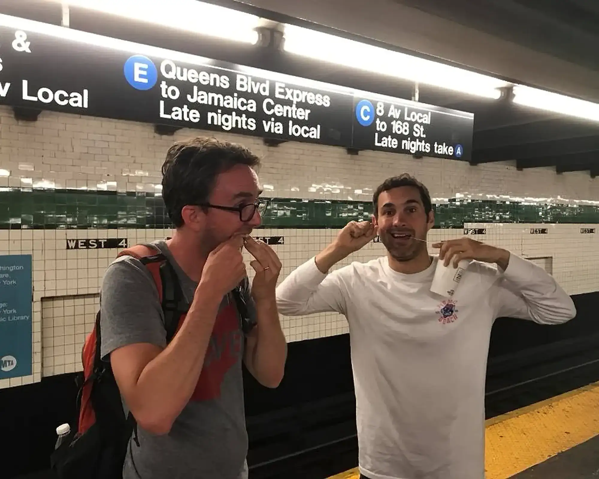 Flossing at Washington Square Station in New York | Mark Normand and Joe List | Tuesdays with Stories Comedians Mark Normand and Joe List of Tuesdays with Stories, flossing with dental floss, at the West Fourth Street–Washington Square Subway Train Station.. Find Mark Normand Tour Dates and Joe List Tour Dates at www.tuesdayspod.com/find-a-show