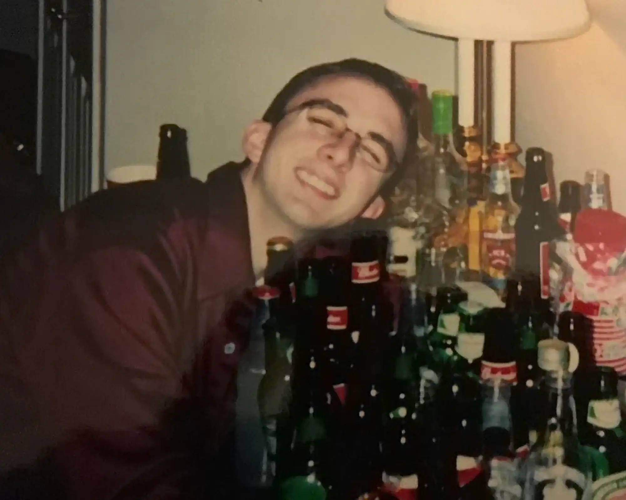Young Joe Hugging Beer Bottle Collection | Joe List | Tuesdays with Stories Comedian Joe List of Tuesdays with Stories when he was young, hugging a collection of beer bottles. Find more about at www.tuesdayspod.com/joe-list