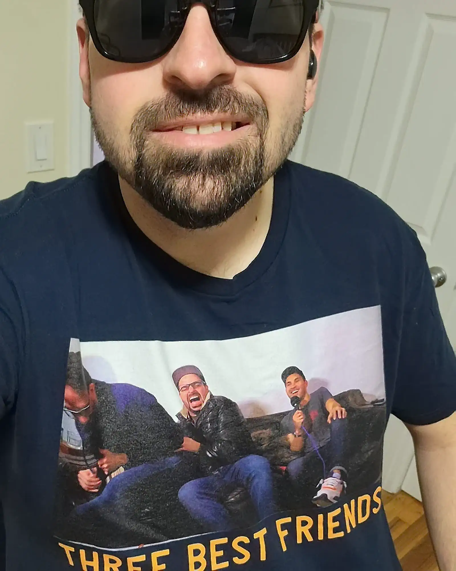 Three Best Friends T-Shirt with Chuck Staton | Mark Normand and Joe List | Tuesdays with Stories Podcasat Producer Chuck Staton wearing a Tuesdays with Stories T-Shirt of himself and hosts Mark Normand and Joe List of Tuesdays with Stories. Find more about Chuck at www.tuesdayspod.com/chuck-staton