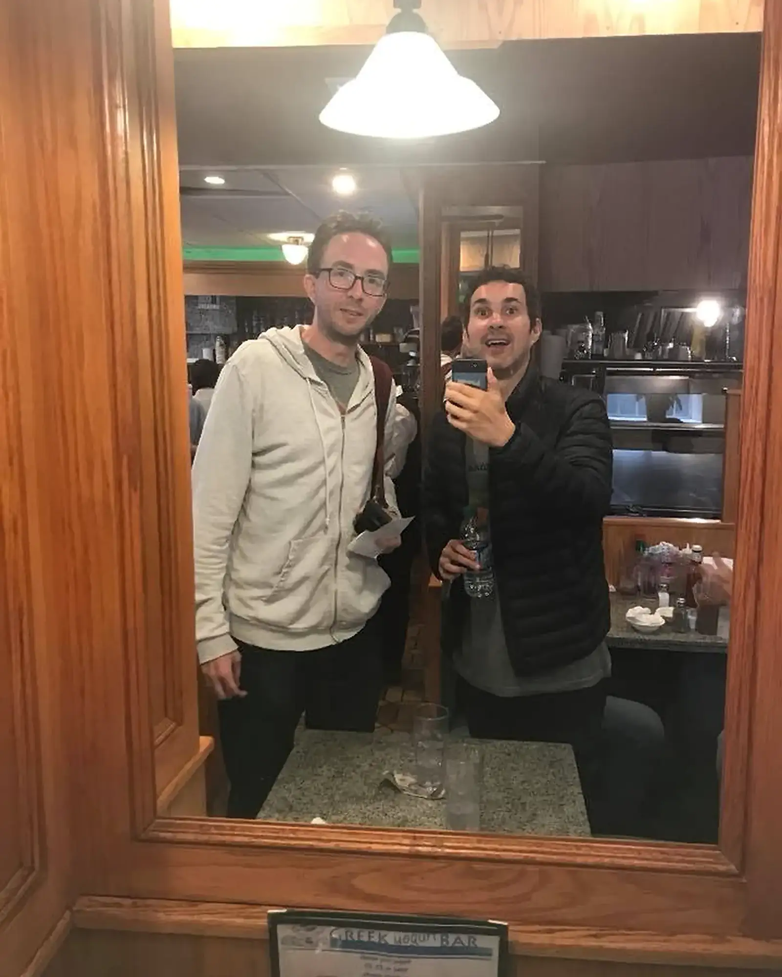 Mirror Pic at the Diner | Mark Normand and Joe List | Tuesdays with Stories Comedians Mark Normand and Joe List of Tuesdays with Stories at a diner, taking a mirror picture. Find Mark Normand Tour Dates and Joe List Tour Dates at www.tuesdayspod.com/find-a-show