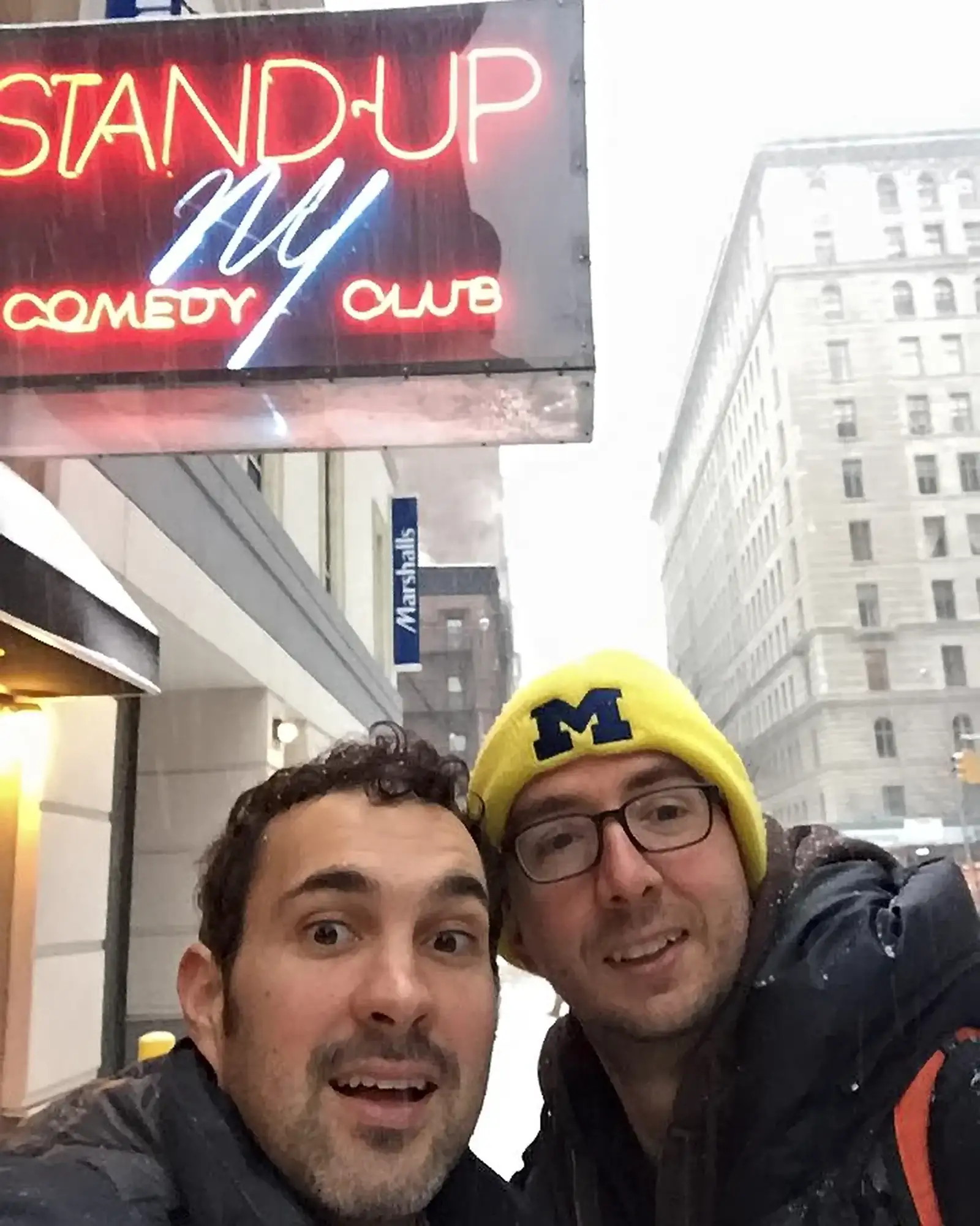 Selfie at Stand Up NY Comedy Club in the Snow | Mark Normand and Joe List | Tuesdays with Stories Comedians Mark Normand and Joe List of Tuesdays with Stories in front of Stand Up NY Comedy Club in New York in the Winter snow. Find Mark Normand Tour Dates and Joe List Tour Dates at www.tuesdayspod.com/find-a-show
