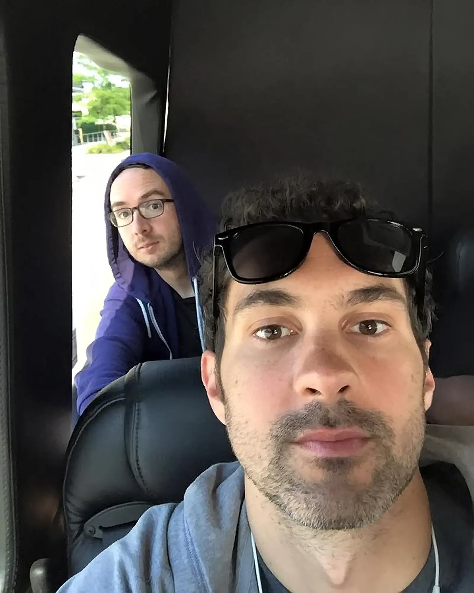 Selfie on the Tour Bus in a Hoodie and Sunglasses | Mark Normand and Joe List | Tuesdays with Stories Comedians Mark Normand and Joe List of Tuesdays with Stories on Tour Bus. Find Mark Normand Tour Dates and Joe List Tour Dates at www.tuesdayspod.com/find-a-show