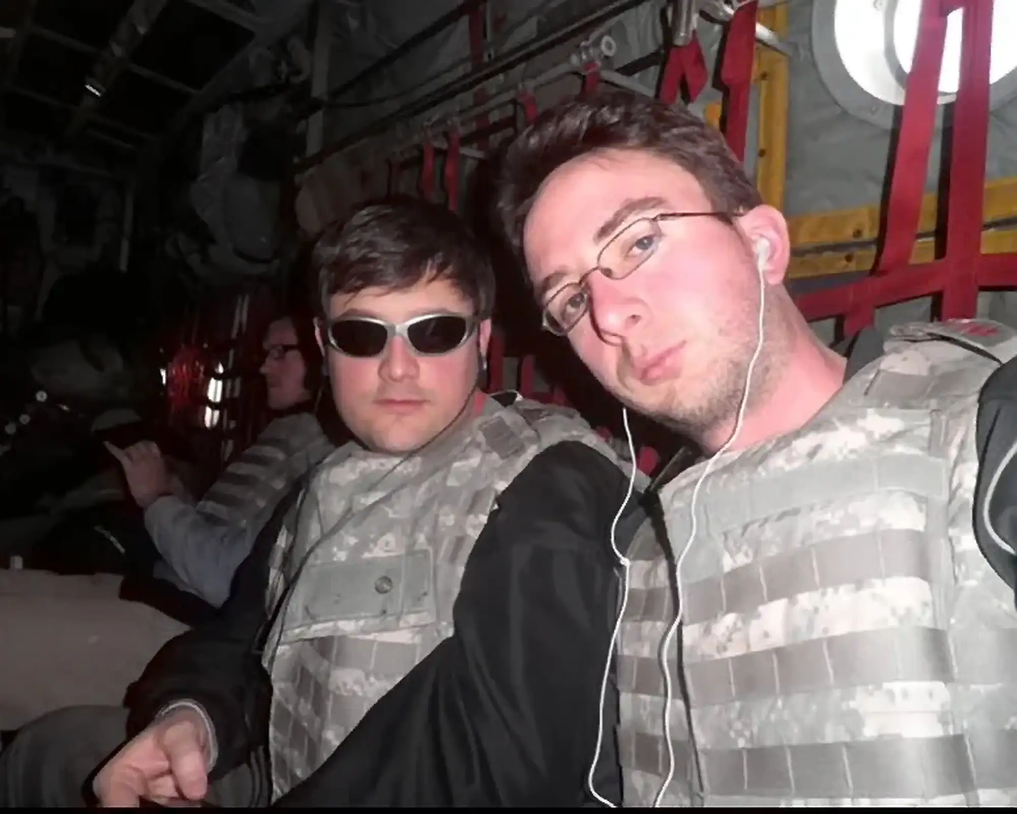 Joe with Nate Bargatze on Military Tour in a US Army Plane in Bullet Proof Camo Vests | Joe List | Tuesdays with Stories Comedian Joe List of Tuesdays with Stories with comedian Nate Bargatze on a military comedy tour, in a US Army plane, in bullet proof camo vests. Find more about at www.tuesdayspod.com/joe-list